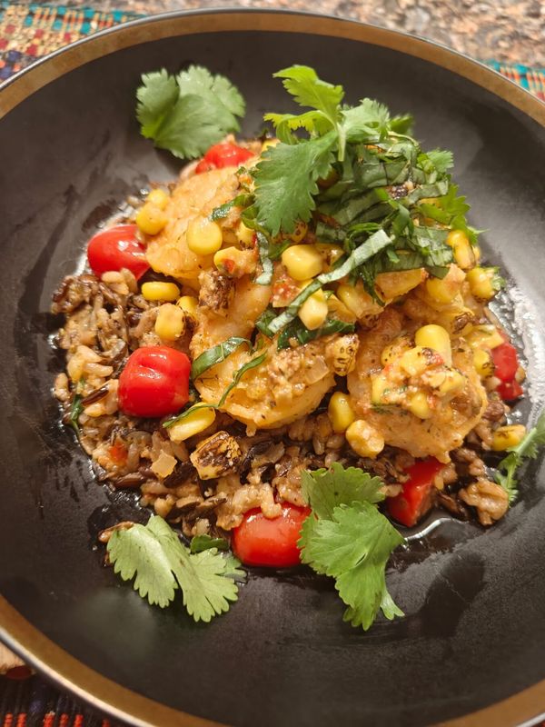 Corn and shrimp over wild rice plated by Chef Brian Schultze, private chef.