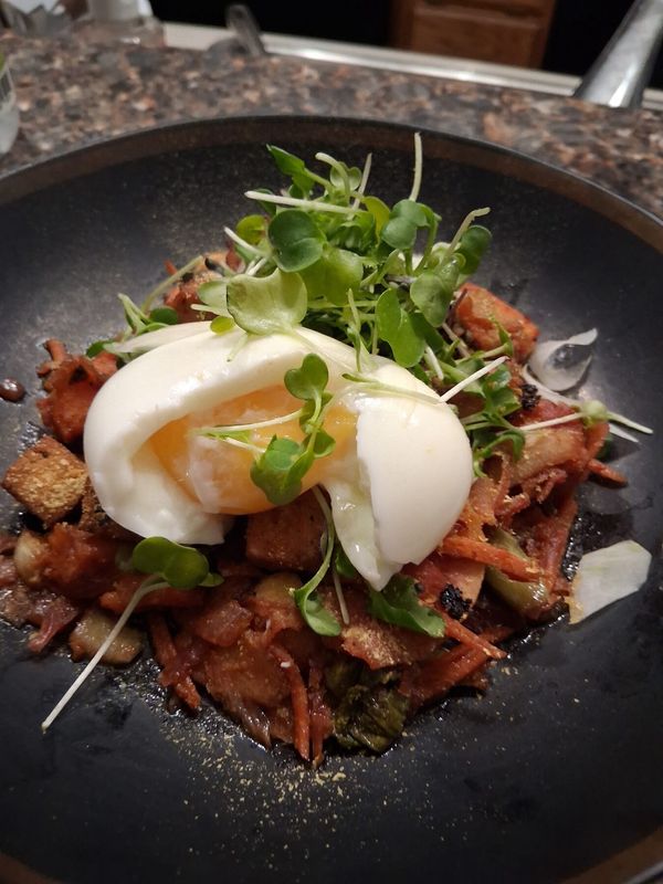 Corned beef hash with poached egg plated by Chef Brian Schultze, private chef.